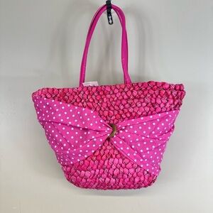 Uddini straw pink nwt 16”w 11” length. Has spot on bow